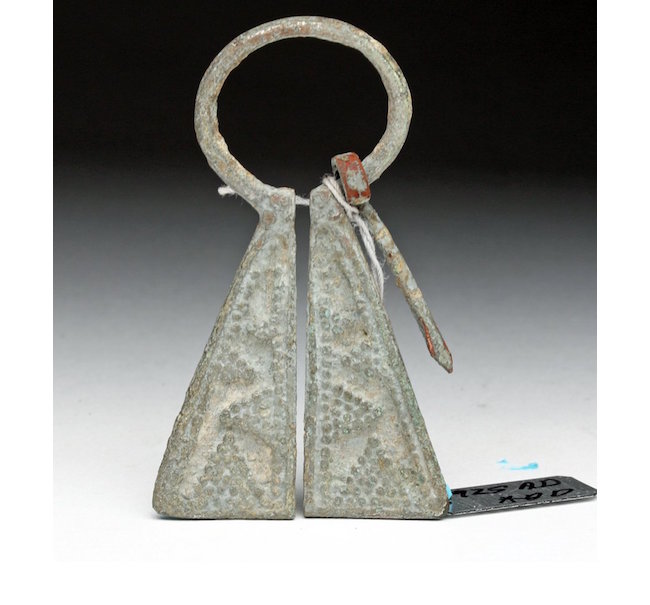 Viking silver brooch, twin-paneled brooch or fibula, each side decorated with grape patterns, Western Europe, ninth to 12th century. Artemis Gallery image